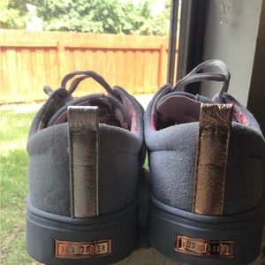 Ted Baker Baby Blue Suede Sneakers lace up with floral pattern inside.